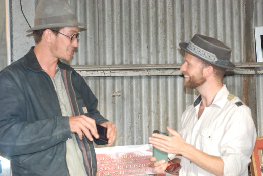 Roland thanks CraftsmanTables co-creator James Cross with flask 